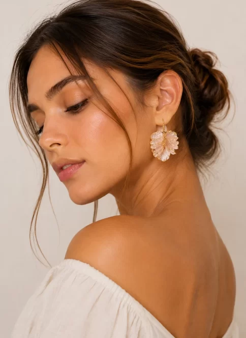 The Whispering Leaf Earrings — delicate golden leaves inspired by the quiet wisdom of nature, flowing softly through the soul of The Vago Botanic Garden Collection.